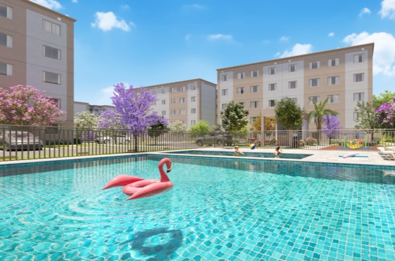 Apartamentos em Camaçari com lazer para toda a família | Piscina com boia inflável e moradores relaxando em um condomínio | Onde Morar | Blog da Tenda 